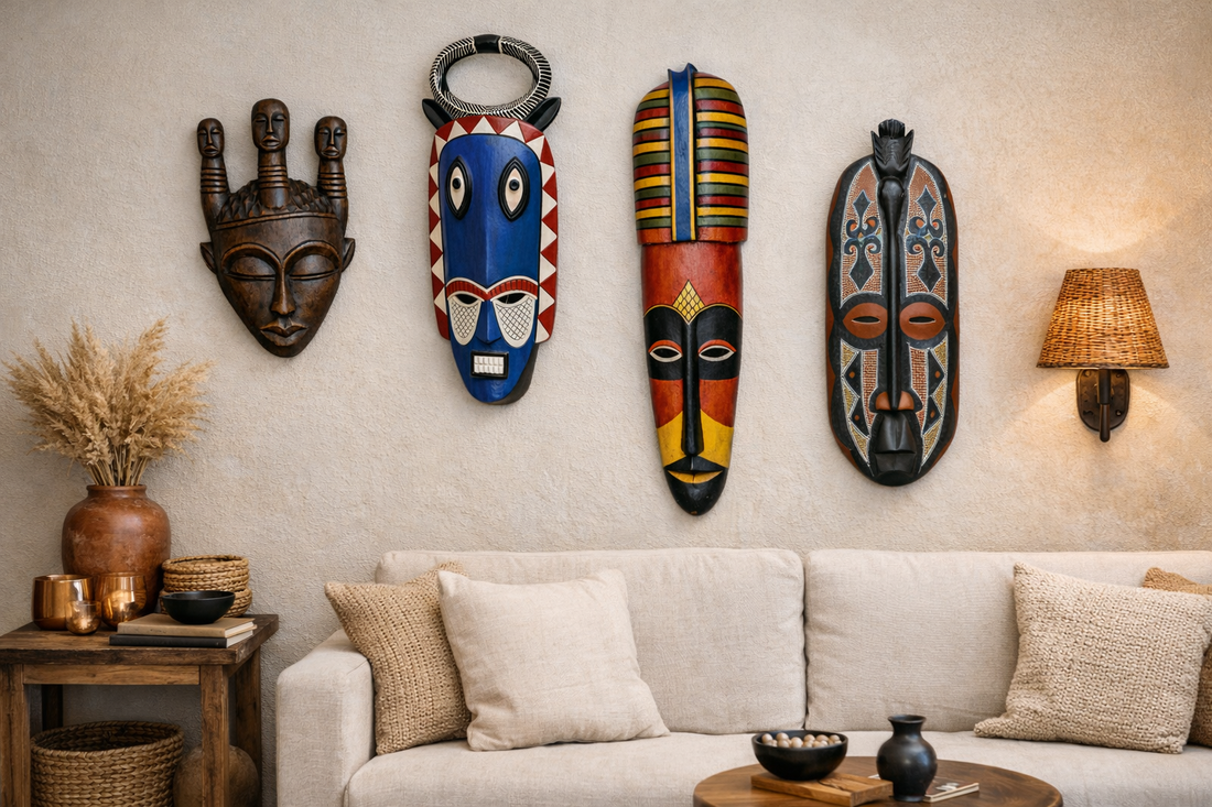 Hand-painted West African wood mask with elongated bridge, black and cream geometric patterns, and red accents, styled as modern wall decor.